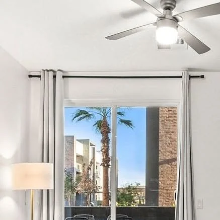 Instagram post: a refreshed model unit, sliding doors open to a palm-lined courtyard