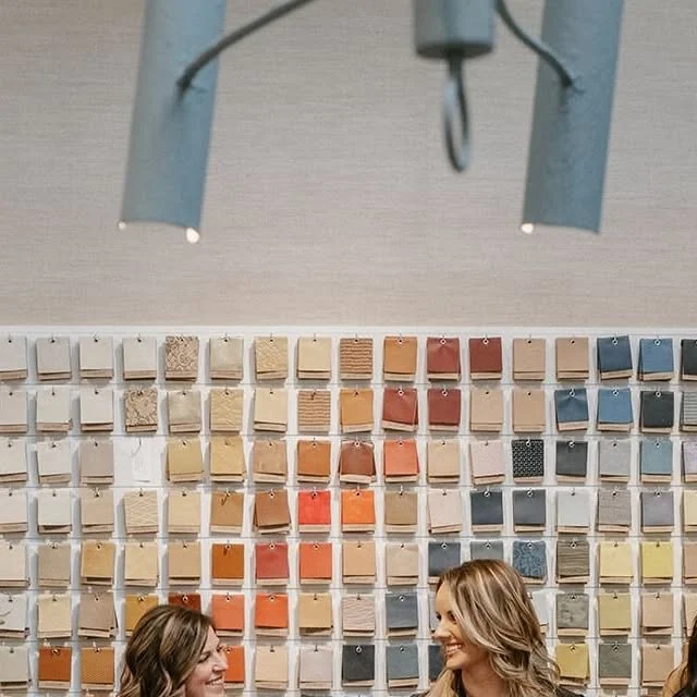 Instagram post: a wall of paint and fabric swatches behind two members of the Catalyst team